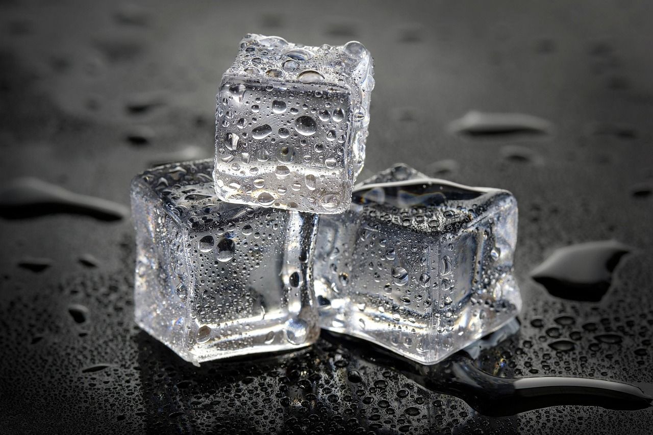 Three melting ice cubes