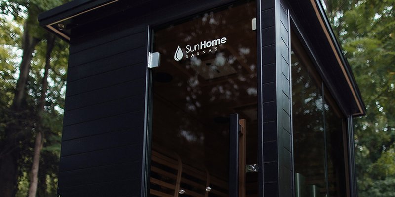 Sun Home Luminar outdoor sauna in backyard setting